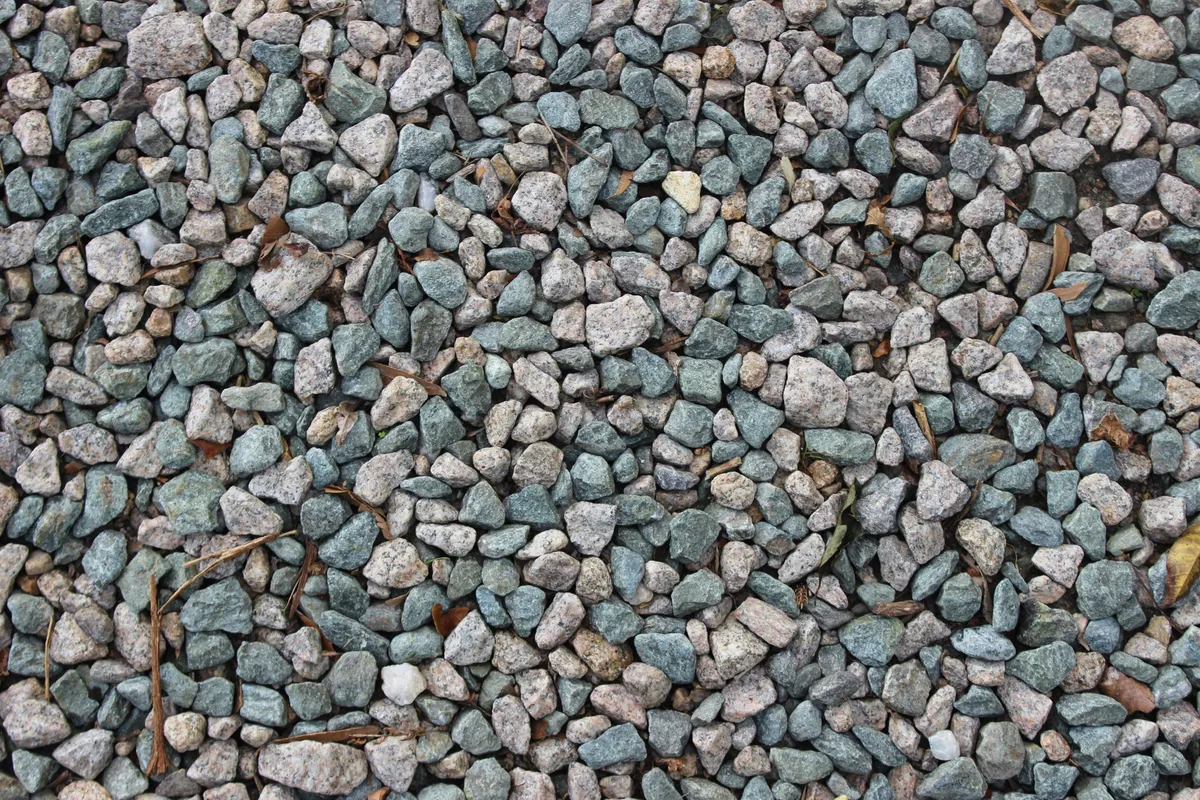 Close-up of small grey and blue-green stones